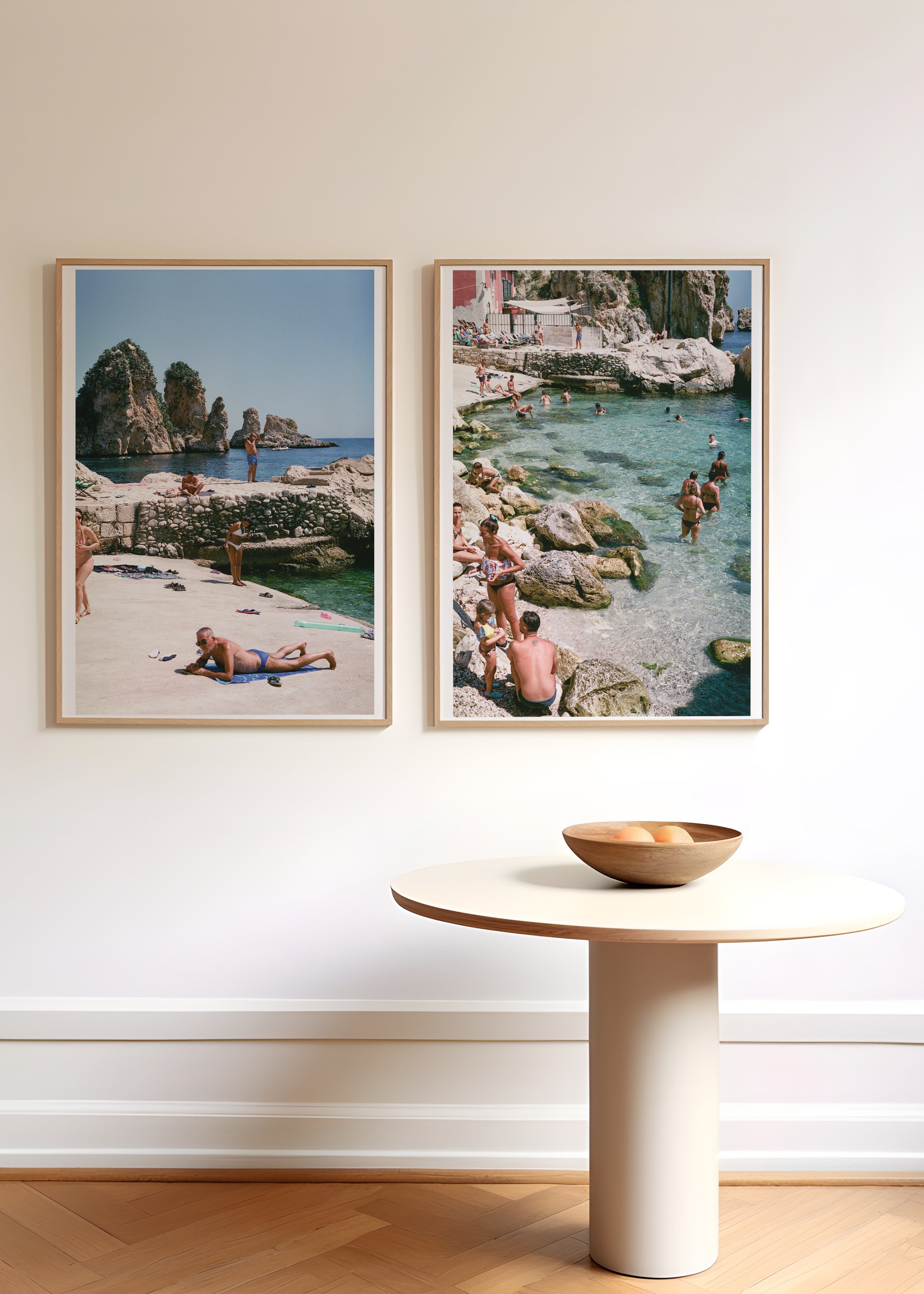 Sara's 'Sicilian Swimming Hole' and 'Sunseekers' print framed in an aesthetic hallway.