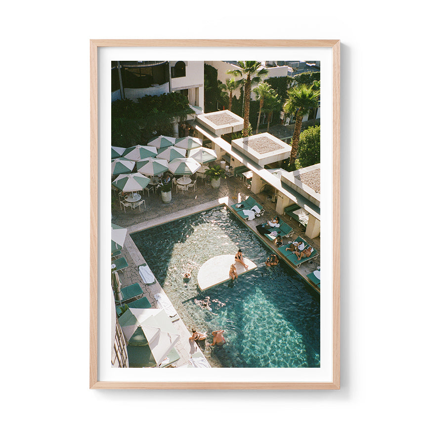 Sara's 'Poolside Hotel' print framed in an oak timber frame.