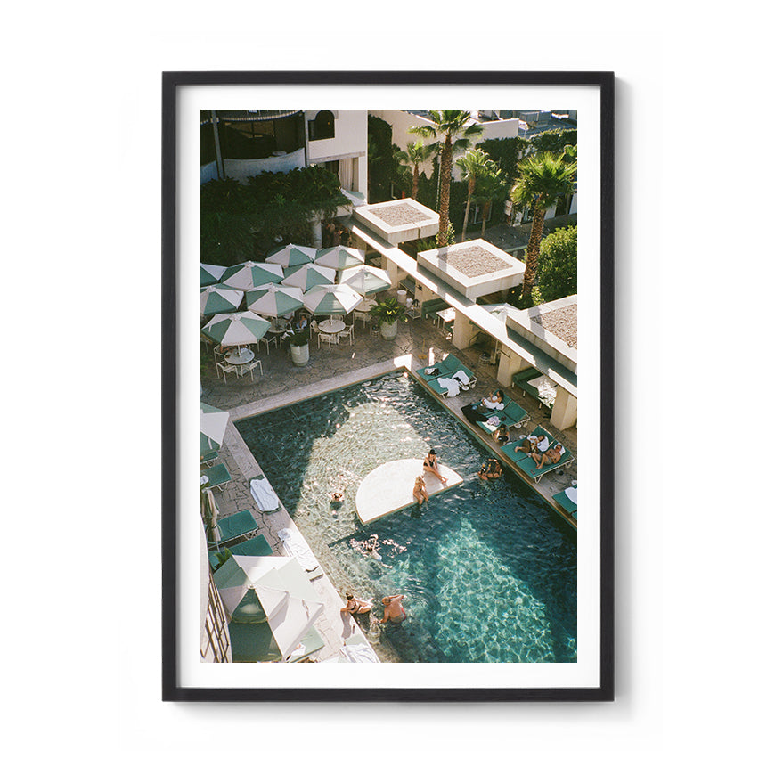 Sara's 'Calile Hotel' print framed in a black timber frame.