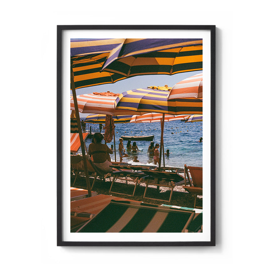 Sara's 'Capri Heat' print framed in a black timber frame.