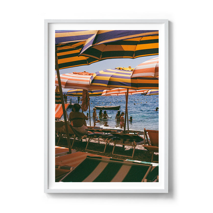Sara's 'Capri Heat' print framed in a white timber frame.