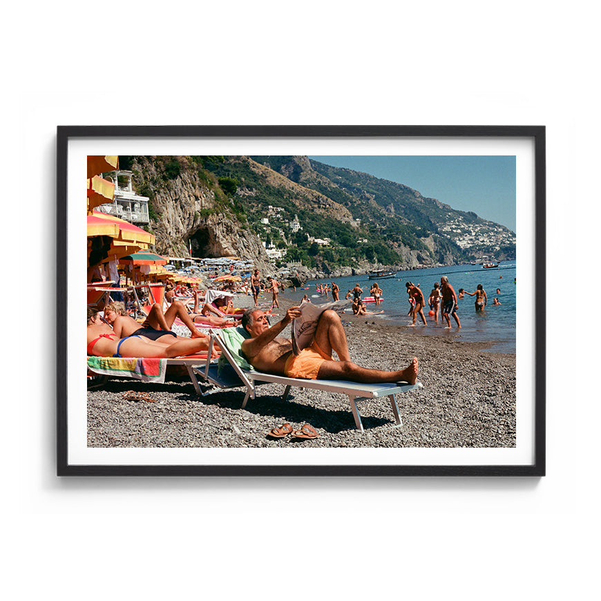 Sara's 'Dolce Far Niente' print framed in a black timber frame.