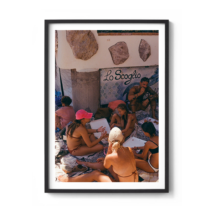 Sara's 'La Famiglia' print framed in a black timber frame.