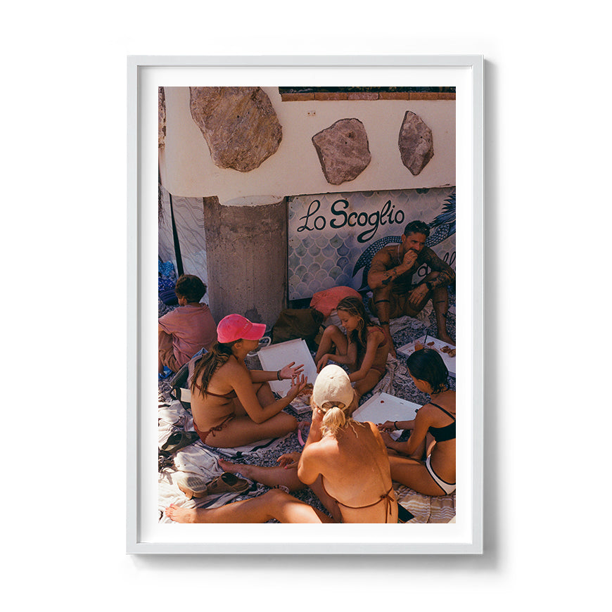 Sara's 'La Famiglia' print framed in a white timber frame.