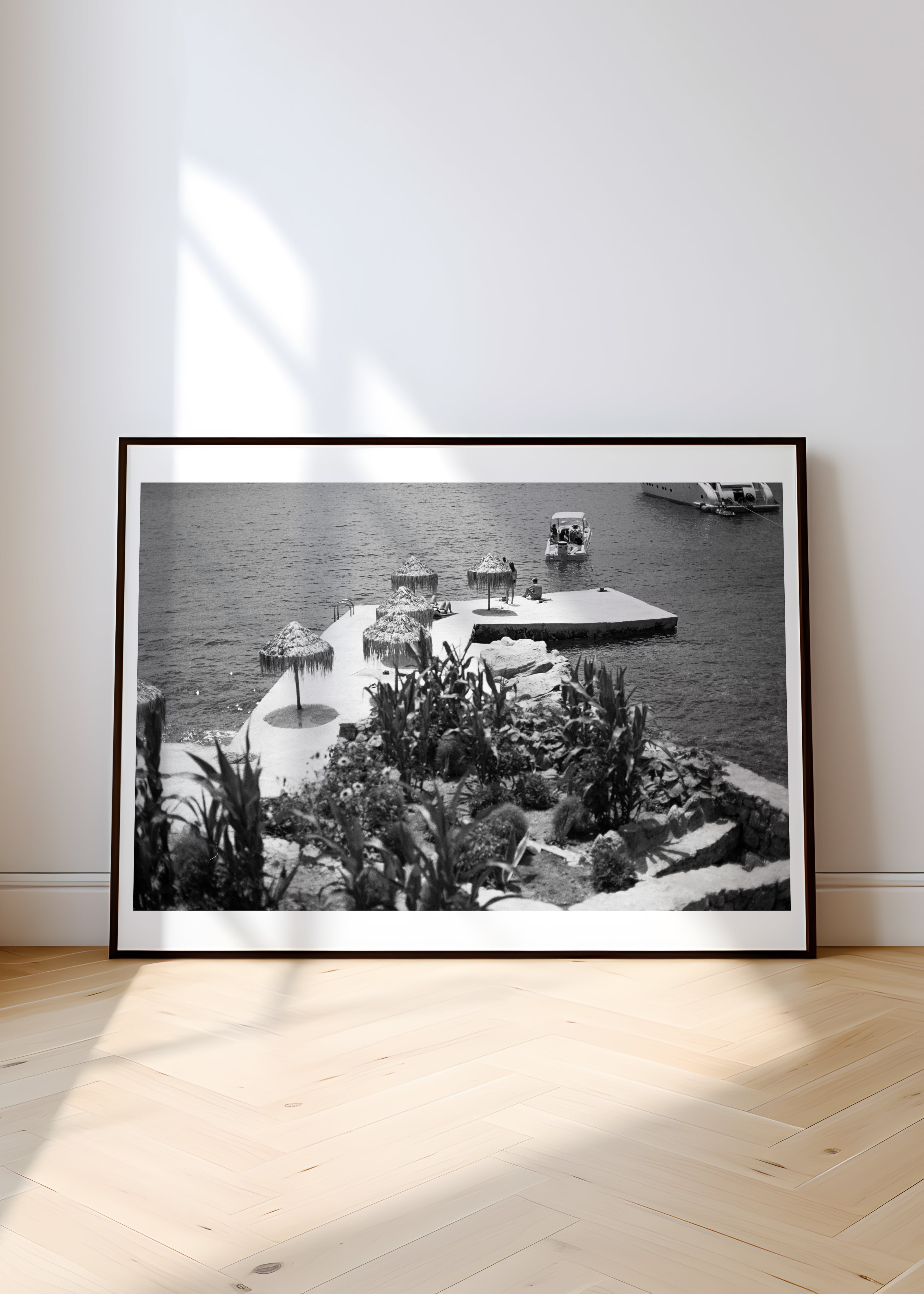 Sara's 'Mykonos' print framed in a hallway.