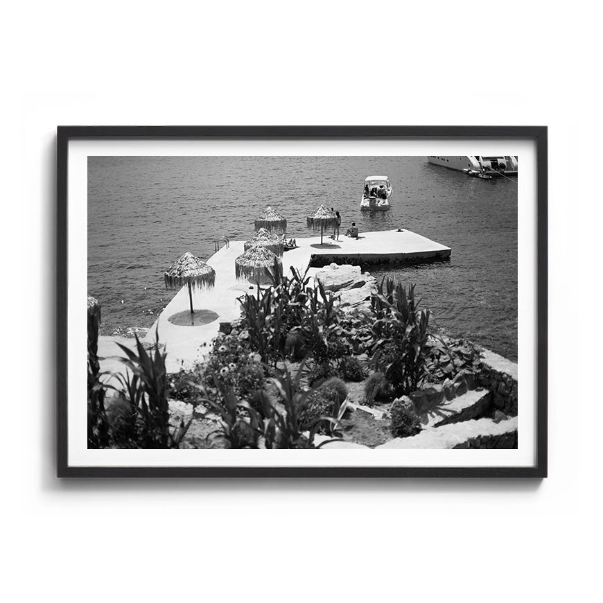 Sara's 'Mykonos' print framed in a black timber frame.