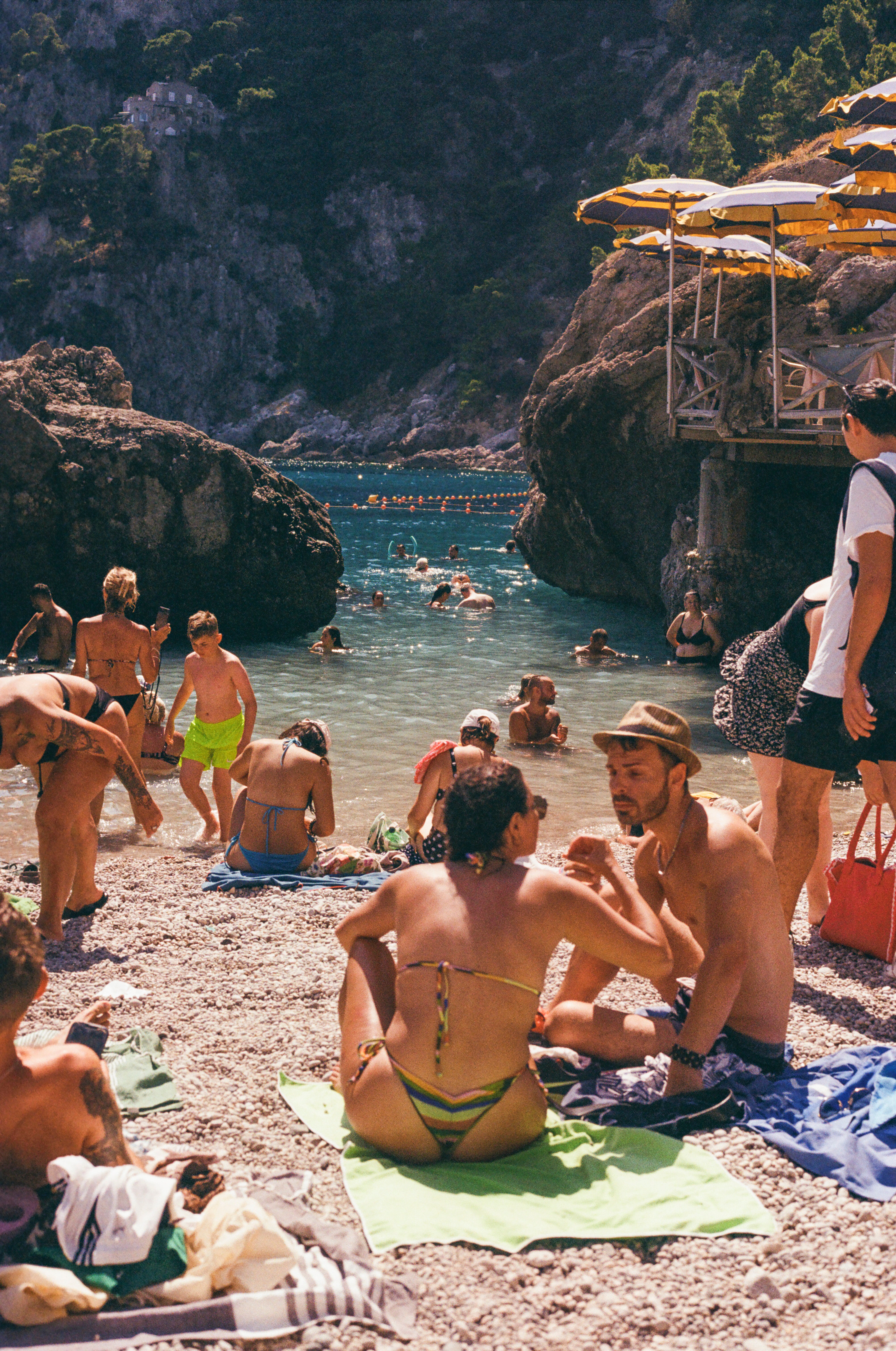 Photograph of a couple having a passionate conversation using hand gestures in Capri, Italy.