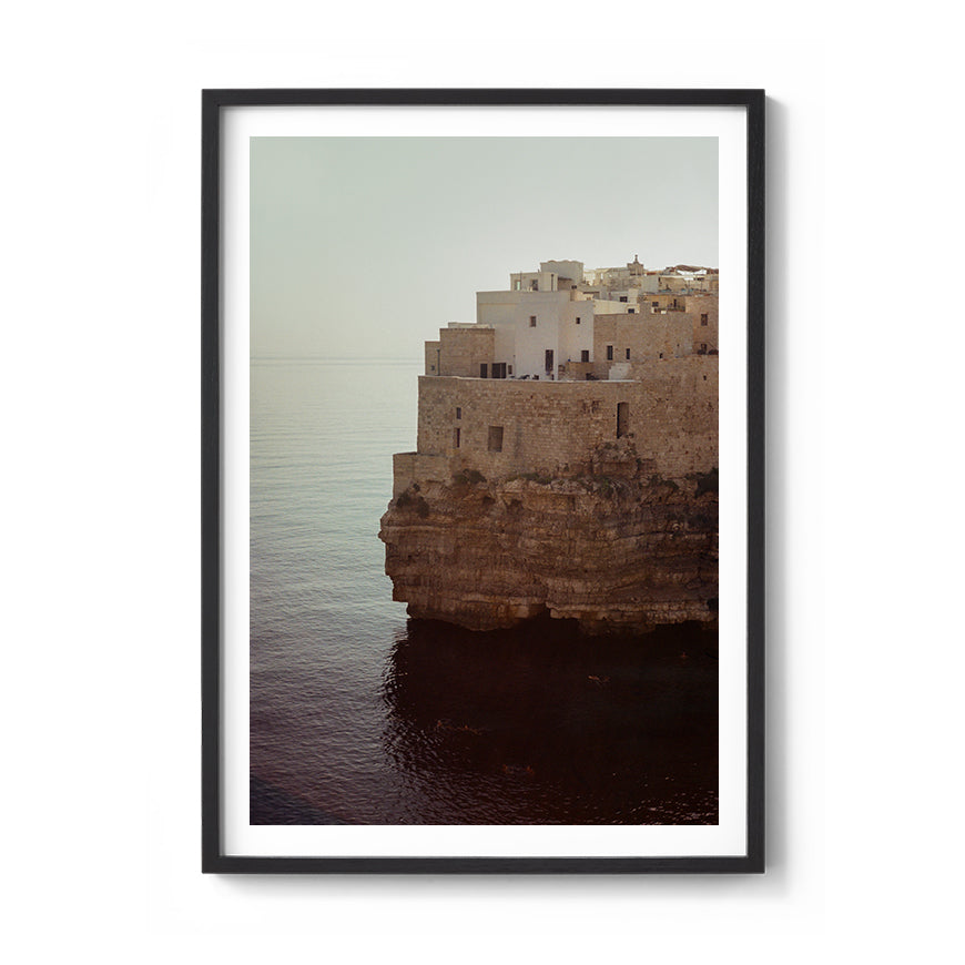 Sara's 'Polignano A Mare' print framed in a black timber frame.
