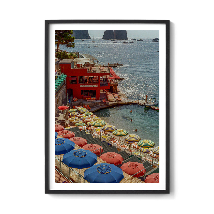 Sara's 'Summer in Capri' print framed in a black timber frame.