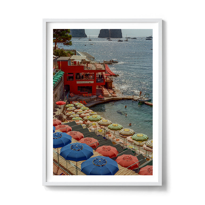 Sara's 'Summer in Capri' print framed in a white timber frame.