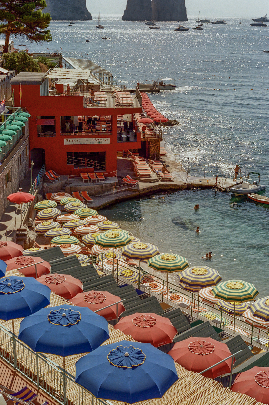 Photograph of Bagni Internazionale beach club, Bagni Di Maria and the sea with the Faraglioni rocks in the background.